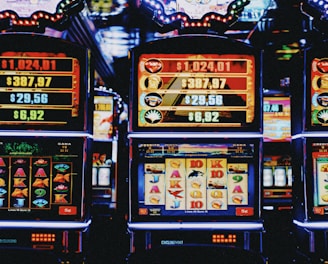 Colorful slot machine reels spinning with animated symbols and glowing lights.